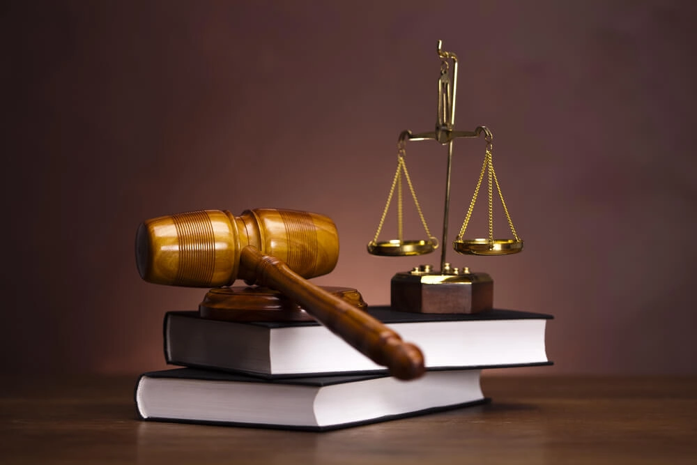 Gavel and scales on law books