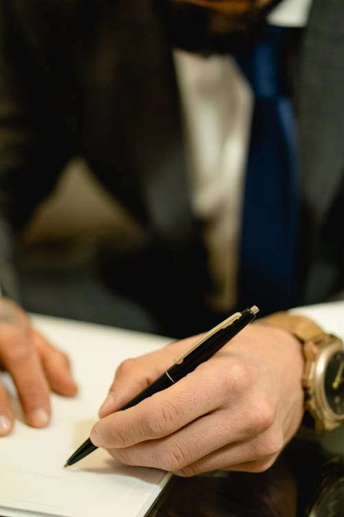 Man writing with a pen