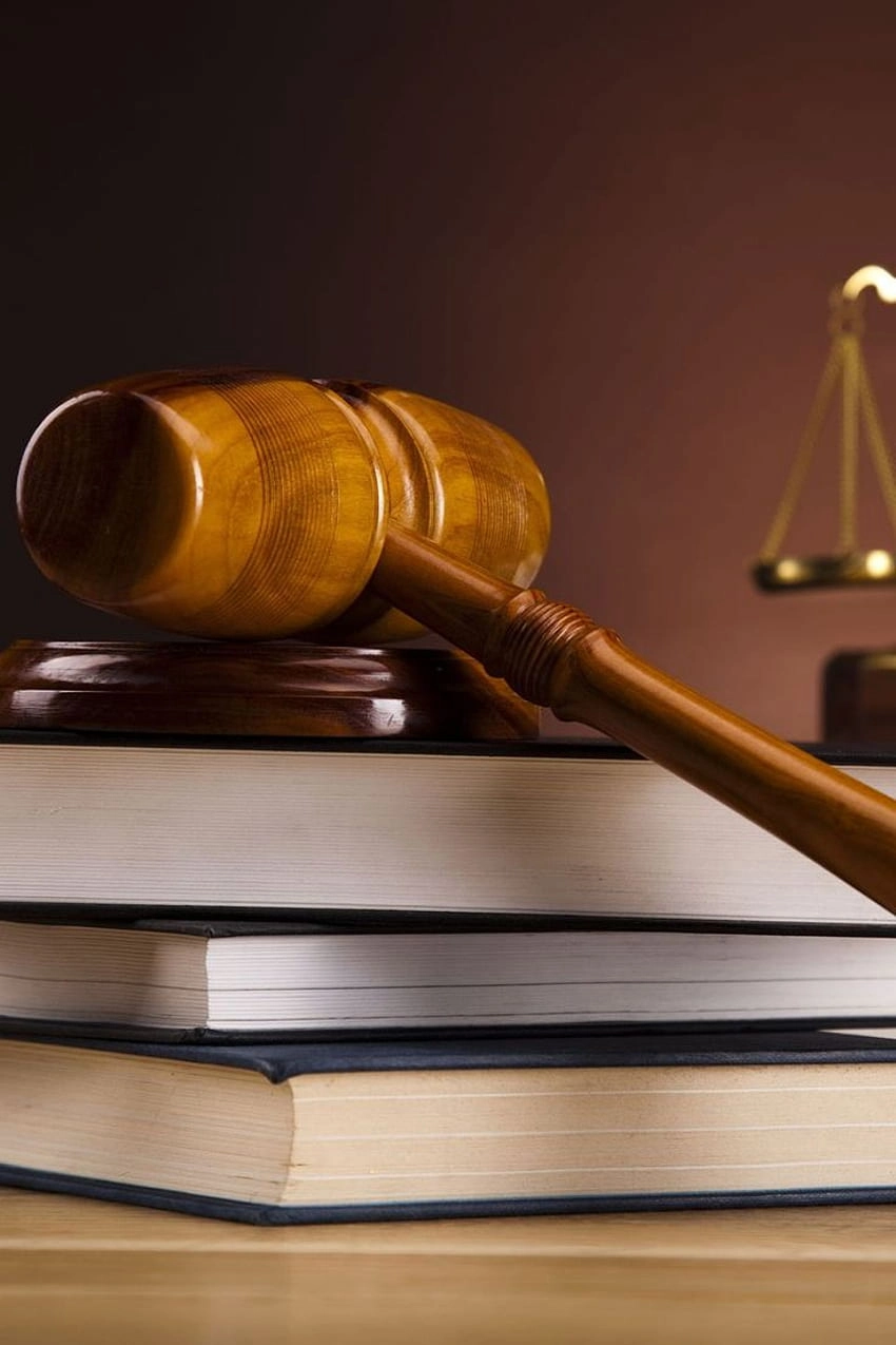 Wooden gavel on stacked books