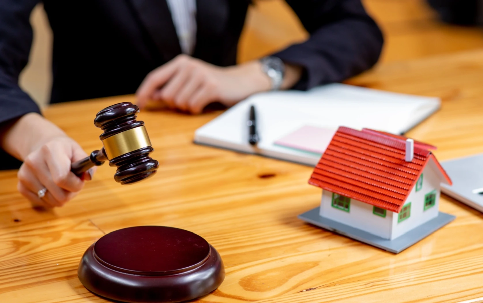 Auction scene with gavel and house