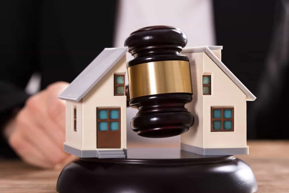 Gavel and houses representing real estate